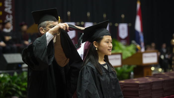 A graduate on commencement day